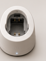 The passive dock's drainage well and magnetic charging contacts.
